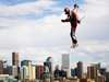 A jet pack flier hovers over Denver, Colorado