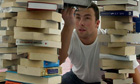 bookseller with towers of second-hand books