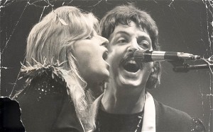 Paul and Linda McCartney singing in concert in 1976.