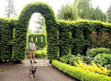 The Port Gamble S'Klallam Tribe has won an auction for Heronswood Gardens and Nursery on the Kitsap Peninsula. Above, property manager Alan Hanson and his dog Sheila are shown at the 15-acre property.