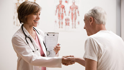 Doctor shaking hands with patient