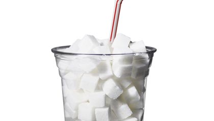 sugar cubes in cup with straw, tax sugar.