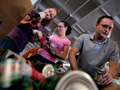 Volunteers organize cans of donated food as part of the Stamp Out Hunger