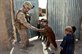 U.S. Marine Corps Cpl. Patrick McCall, left, receives a high five from an Afghan boy during a security patrol in the Sangin district in Afghanistan's Helmand province, Sept. 6, 2012. McCall is a rifleman assigned to Bravo Company, 1st Battalion, 7th Marine Regiment, Regimental Combat Team 6. U.S. Marine Corps photo by Lance Cpl. Jason Morrison