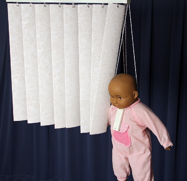 Picture of recalled vertical window blind showing cord strangulation hazard