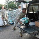 Photo: 120901-A-SM895-027

NEW ORLEANS - Senior Airman Randy Bullock, air traffic controller with the Louisiana National Guard's 259th Air Traffic Control Squadron, loads a case of water into the back of a vehicle of a resident affected by Hurricane Isaac in New Orleans, Sep. 1, 2012. The LANG has more than 6,000 Soldiers and Airmen on duty to support our citizens, local and state authorities by conducting Hurricane Isaac operations. (U.S. Army photo by Spc. Tarell J. Bilbo, 241st Mobile Public Affairs Detachment/RELEASED) Digital