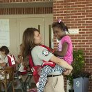 Photo: LaPlace, La., Sep. 7, 2012 -- An AmeriCorp worker plays with a child at a Red Cross shelter in LaPlace, La. AmeriCorp and FEMA are working with local, state and other federal agencies to assist residents affected by Hurricane Isaac.