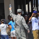 Photo: LaPlace, La., Sep. 5, 2012 -- With the heat index above 100 degrees, National Guardsmen offer cold water to people waiting in line to sign up for food stamps. Under a program from the United States Department of Agriculture (USDA), the USDA is assisting those affected by Hurricane Isaac with food stamps because of the loss their mail or a change in financial circumstances.