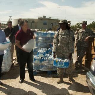 Photo: Slidell, La., Sep. 2, 2012 -- DHS Sec. Janet Napolitano along with Sen. Mary Landrieu (D-La.) joins a member of the Louisiana National Guard in distributing ice to residents in Slidell, La., who were affected by Hurricane Isaac. Napolitano visited LA and MS to assess the current needs of the areas affected by Hurricane Isaac. Napolitano has ordered FEMA to provide assistance to the affected areas.