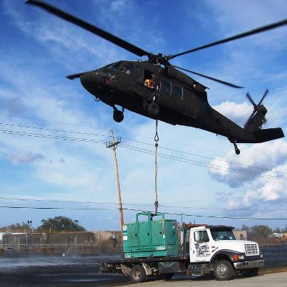 Photo: PORT SULPHUR, La. – A Louisiana Army National Guard UH-60 Black Hawk helicopter transports a much-needed 5,000-pound generator to a water treatment plant in Plaquemines Parish after flooding caused by Hurricane Isaac, Sept. 5, 2012. (U.S. Army photo by 1st. Sgt. Kevin M. Currie, 1-244th Assault Helicopter Battalion/RELEASED)