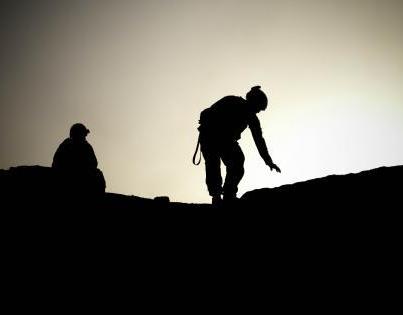 Photo: Paratroopers with 3rd Platoon, Company D, 2nd Brigade, 505th Parachute Infantry Regiment, 82nd Infantry Division, switch security shifts early in the morning, Aug. 30, 2012, in a compound in Mulakala, Afghanistan. (U.S. Army photo by Spc. Alex Amen)