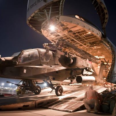 Photo: 120831-F-SI013-303

Airmen and Soldiers load a U.S. Army AH-64 Apache attack helicopter aboard a U.S. Air Force C-5B Galaxy at Bagram Airfield, Afghanistan Aug. 31, 2012. The C-5 has a greater capacity than any other USAF airlifter and can simultaneously carry three dozen pallets and more than 80 people. The aircraft’s capacity is large enough to carry any of the Army's air-transportable combat equipment. (U.S. Air Force Photo/Capt. Raymond Geoffroy) Digital