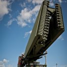 Photo: Airman 1st Class Daniel Hilliard hand-cranks the deployment of a TPS-75 radar set antenna in support of a 728th Air Control Squadron deployment readiness exercise called Bison Fury July 24, 2012, at Eglin Air Force Base, Fla.