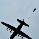 Photo: An Airman jumps out of a C-130 Hercules during a combat mission readiness evaluation over Fort Bragg, N.C. The Airman is assigned to the 18th Air Support Operations Group.