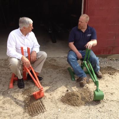 Photo: One of the things I enjoy most about the “Make it in Maine” manufacturing tour is the ability to meet with local businesses and hear about their successes and their challenges.  I took a moment to sit with Jason Powers of MP&G Machine & Design on one of their DIGGIT American-made construction toys, to discuss how the current climate is affecting their business.