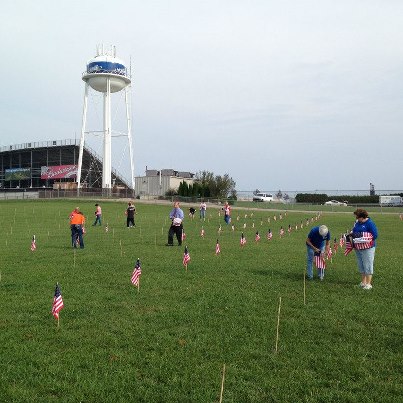 Photo: On September 7th I placed flags in front of the Michigan International Speedway Administration building with fellow citizens to recognize the victims of 9/11.