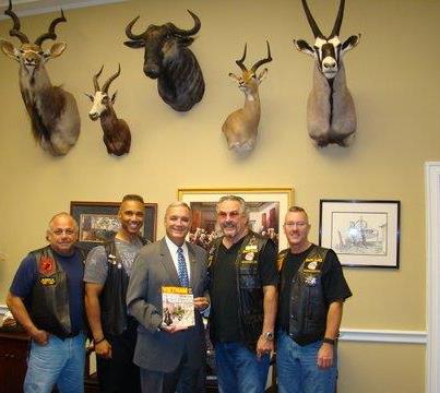 Photo: Chairman Jeff Miller posing for a photo with Rolling Thunder Washington, DC Inc.