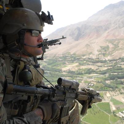 Photo: A U.S. Soldier looks out over Khas Uruzgan district, Afghanistan, from the door of a UH-60 Black Hawk helicopter Aug. 29, 2012. (DoD photo by Petty Officer 3rd Class James Ginther, U.S. Navy/Released)