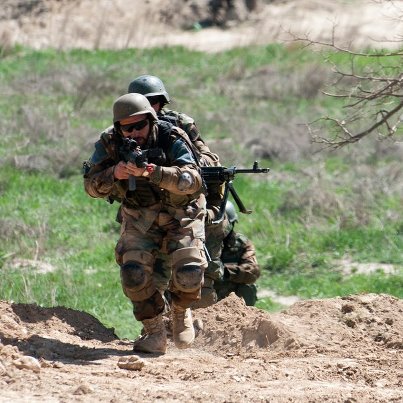 Photo: Afghan Special Forces demonstrate an assault exercise.