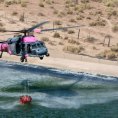 Photo: California Air National Guard HH-60G Pave Hawk rescue helicopter and crew, from the 129th Rescue Wing collect water in preparation for bucket drops over the Jawbone Complex Fire in Kern County, Calif., Aug. 15, 2012. In support of the Bureau of Land Management, the 129th aircrews have performed more than 120 bucket drops. (Air Force photo by Master Sgt. Julie Avey)