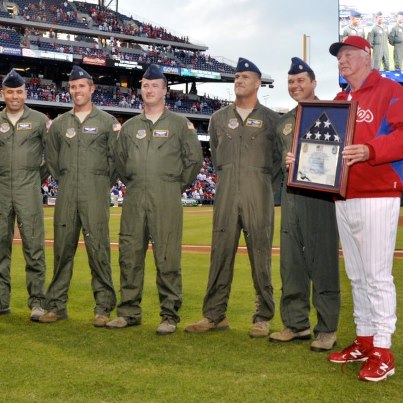 Photo: L to R: Lt. Col. Mike Zanetti (navigator), Master Sgt. Christian Essick (flight engineer), Capt. Jason Subach (co-pilot), Tech. Sgt. John Wygant (loadmaster), Lt. Col. Robert Culcasi (aircraft commander), and Lt. Col. Chris Kilcullen with Philadelphia Phillies manager Charlie Manuel at Citizens Bank Field, Patriot Day, Sept. 11, 2012. Col. Culcasi presented the framed U.S. flag and certificate to the Phillies during the pre-game ceremony in appreciation of their support of the Delaware National Guard. The flag had been flown aboard a Delaware Air National Guard C-130H aircraft on a combat mission over Afghanistan in support of Operation Euduring Freedom. (U.S. Army photo/Staff Sgt. Daniel Grobelny). (bjm)