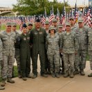 Photo: Members from the 161st Air Refueling Wing gather to observe American flags at the 9th annual Healing Field memorial, Tuesday Sept 11, 2012, in Tempe Ariz. All of the 2,996 flags represent a person who was lost during the attacks on the World Trade Center, the pentagon and Pennsylvania in 2001. Each flag was marked with a placard with the name of the individual and information about them and were they died. Combat boots mark flags representing soldiers, yellow ribbons signify the first responders and sky-blue ribbons denote the flags of airline crews and while teddy bears mark flags for the children who died.(U.S. photo by: Tech. Sgt. Susan Gladstein/Released)