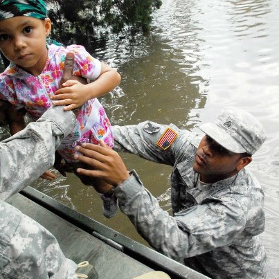 Photo: Sgt. Lee Savoy, a Soldier with the 256th Brigade Special Troops Battalion, Louisiana National Guard, evacuates a child from the Hurricane Isaac flood waters Aug. 30. U.S. Army photo by Sgt. Rashawn D. Price.