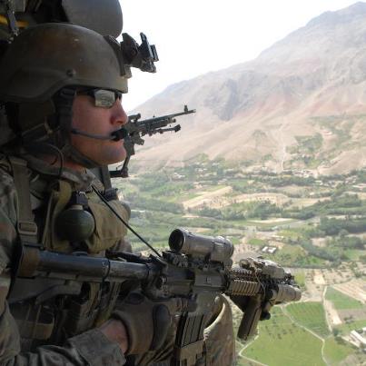 Photo: A Soldier looks out over Afghanistan, from the door of a UH-60 Black Hawk helicopter Aug. 29. DoD photo by Petty Officer 3rd Class James Ginther, U.S. Navy