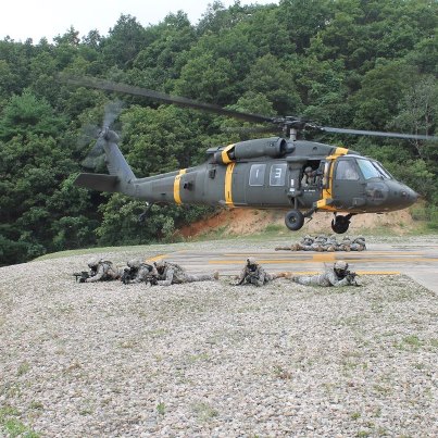 Photo: Soldiers from 27th Infantry Regiment, 2nd Stryker Brigade Combat Team, 25th Infantry Division air assault from a UH-60 Black Hawk and begin their raid on the objective during training in South Korea.