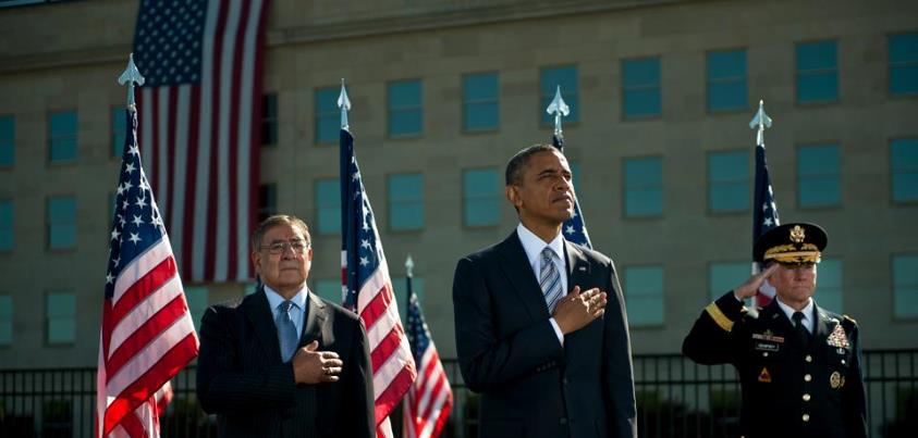 Photo: Defense Secretary Leon E. Panetta, President Barack Obama and Army General Martin E. Dempsey, Chairman of the Joint Chiefs of Staff, render honors as the national anthem plays during the ceremony to commemorate the 11th anniversary of the 9/11 terrorist attacks at the Pentagon, Sept. 11, 2012. DoD photo by U.S. Navy Petty Officer 1st Class Chad J. McNeeley