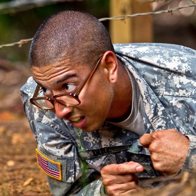 Photo: Sgt. Fernando Diaz crawls under barbed wire while completing the confidence course during the 2012 Pacific Regional Medical Command Best Medic Competition on Schofield Barracks in Wahiawa, Hawaii, Aug. 29, 2012. Diaz, a combat medic, is assigned to the 568th Medical Company. DOD photo by U.S. Air Force Tech. Sgt. Michael R. Holzworth