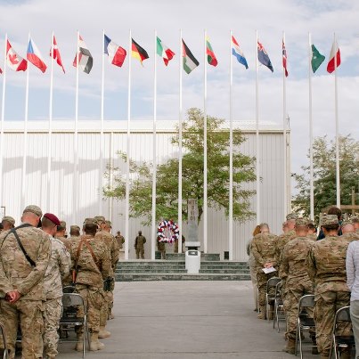 Photo: Soldiers and civilians observe a moment of silence during a 9/11 remembrance ceremony on Bagram Air Field, Afghanistan, Sept. 11. U.S. Army photo by Sgt. Roland Hale