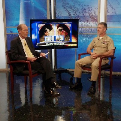 Photo: Capt. Rick Burgess, commanding officer of NCBC,  waiting to be interview by Dave Elliot at WLOX-TV about the Seabee Volkslauf Mud Run 2012, Sept. 7. (US Navy Photo by Rob Mims/Released)