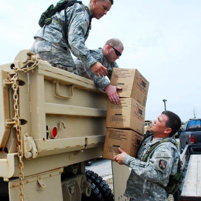 Photo: Photo of the Day: Soldiers with Louisiana National Guard, collect MREs and water from a Blackhawk for distribution at the Emergency Operation Center in Grand Isle. The LANG has more than 8,000 Soldiers and Airmen ready to support citizens, local and state authorities in support of Hurricane Isaac operations.