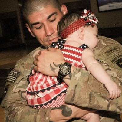 Photo: This is a picture of my husband, SGT Michael "Brennan" Leslie, returning home from Afghanistan and meeting our daughter for the first time. She is 5 months old. We're so grateful that he made it home safe and sound!