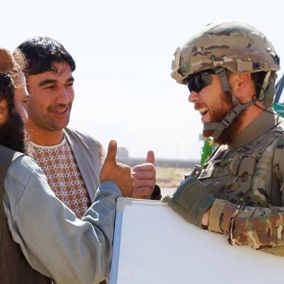 Photo: Caption This Photo of the Day: Kentucky National Guard ADT4’s Civilian Agricultural Specialist Jonathon Mixon spends time with local Afghans before helping with grape classes for local farmers in southern Afghanistan.