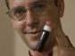 George Huber poses with a vial of green gasoline compounds.