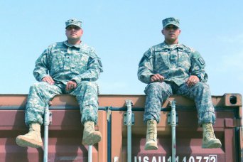 Staff Sgt. Tyler Isenhour (on right), from Concord, N.C., and Spc. Jeffrey Brewer, both North Carolina National Guard Soldiers from the 1452nd Transportation Company, served on Mobile Container Assessment Teams in Afghanistan. Their hard work resulted in the identification of 82 commercial containers that were previously unaccounted for and worth more than $1,245,000 in government property and detention fees.