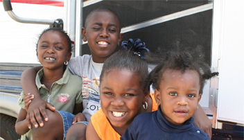 Four smiling children