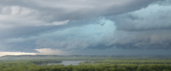 Storm clouds gathering over a rural area