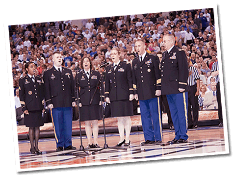 The U.S. Army Field Band's Soldiers' Chorus sings the National Anthem before a basketball game.