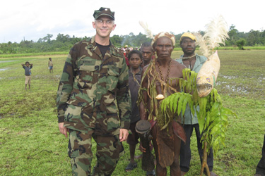 CDR John Moroney with locals from Josphstaal, a very remote area of Papua New Guinea.
