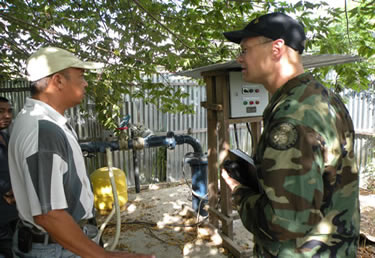 Photo:LCDR Andrew Sallach, a civil engineer, conducts a site visit and water sample testing at the National  Hospital in Dili, East Timor.