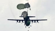 C-130 Hercules drops Army paratroopers of the 82nd Airborne Division onto Luzon drop zone during a training mission. (U.S. Air Force photo/Tech. Sgt. Edward Gyokeres)