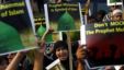 Indonesian Muslims shout slogans as they hold a banner which reads "Prophet Muhammad is symbol of Islam" during a protest against an anti-Islam film that has sparked anger among followers, outside the U.S. Embassy in Jakarta, Indonesia, Sept. 14, 2012. 