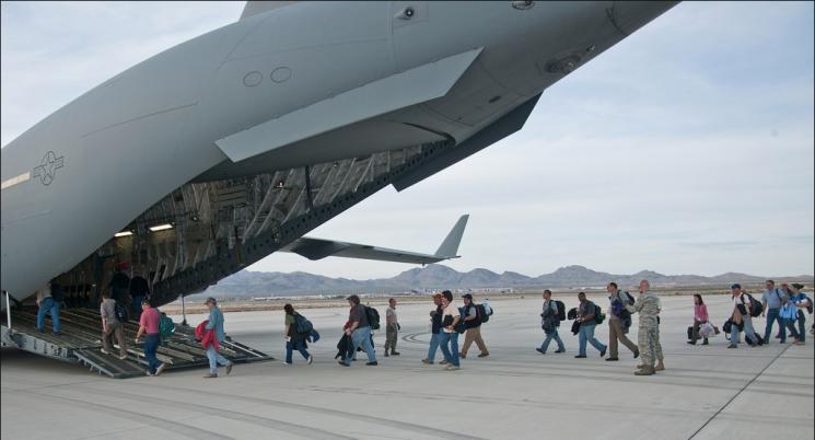 National Security Technologies scientists, technicians and engineers from the National Nuclear Security Administration’s Nevada Site Office board the Air Force C-17. Highly trained nuclear emergency response personnel and more than 17,000 lbs of hi-tech equipment are being sent to Japan as part of the Department of Energy and National Nuclear Security Administration’s effort to assist Japanese personnel with nuclear issues. | Photo Courtesy NNSA News