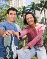 Photo: A man and woman exercising
