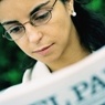 Woman reading a newspaper