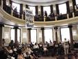 A protester interrupts a City Council vote Wednesday on whether to add fluoride to city water in Portland, Ore.