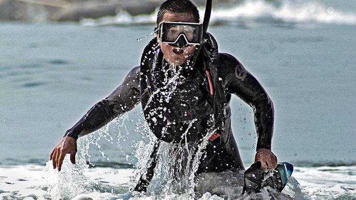 Aviation Aircrewman completes a swim relay during the Annual Aircrew competition. 